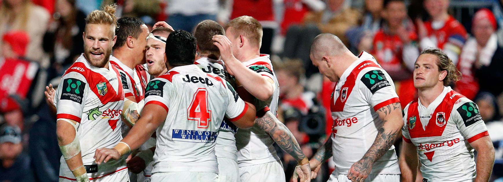 Dragons players celebrate during their win over the Sharks.