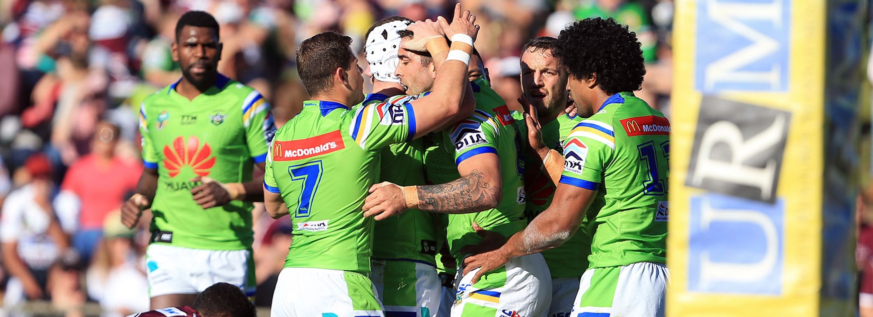 Raiders players celebrate during their win over the Sea Eagles in Round 25.