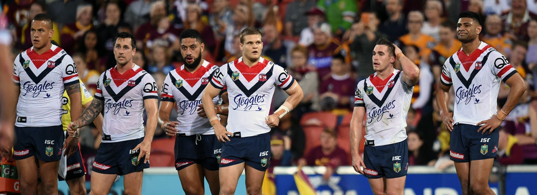 Roosters players look on in their loss to the Broncos.