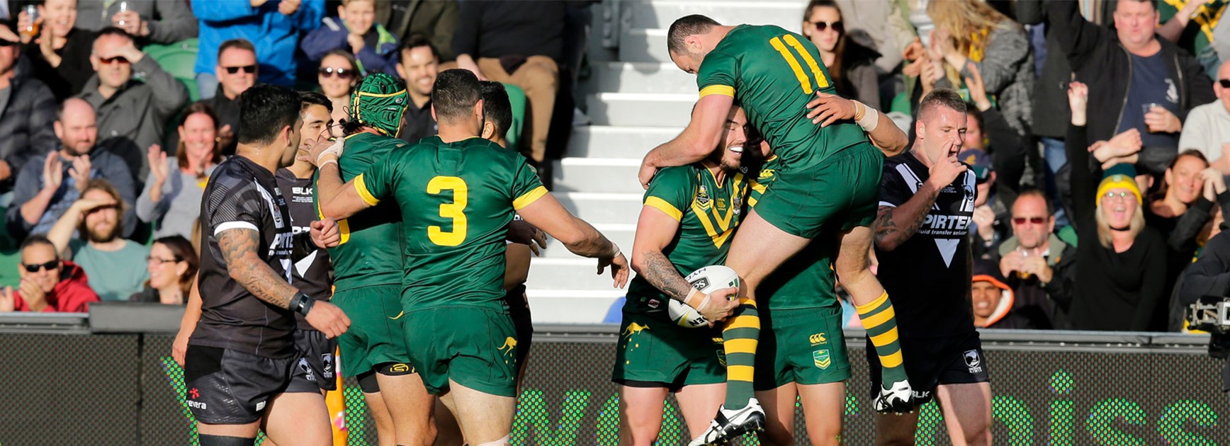 The Kangaroos celebrate Darius Boyd's opening try against New Zealand on Saturday.