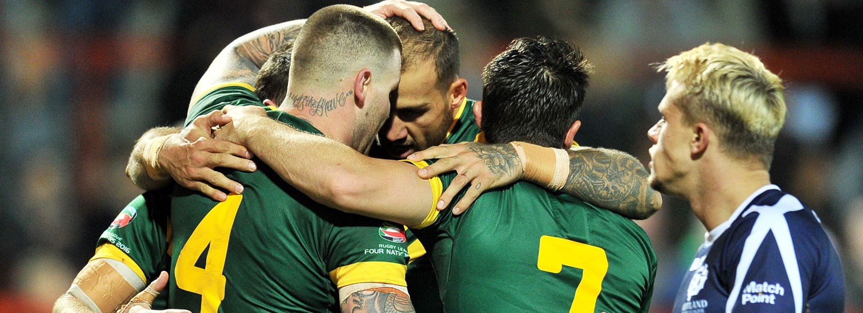 Kangaroos players celebrate during their big win over the Bravehearts to open the 2016 Four Nations.