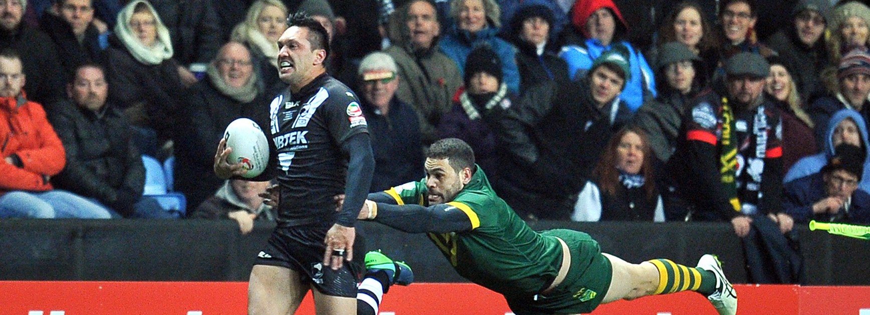 New Zealand's Jordan Rapana is chased down by Australia's Greg Inglis in the Four Nations in Coventry.