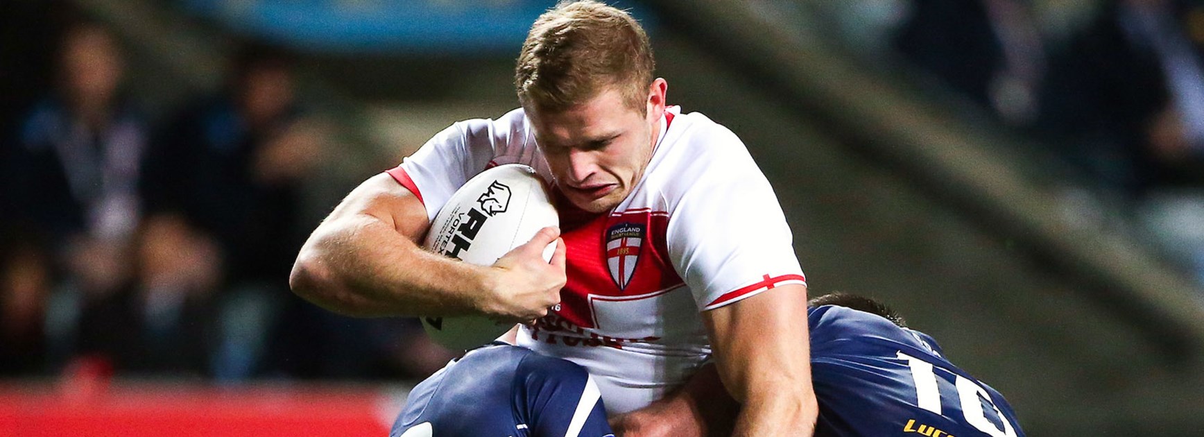 England prop George Burgess crashes into the Scotland defence.