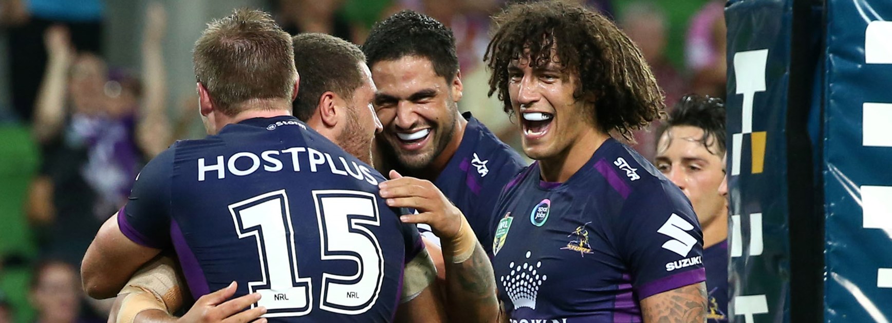 Kevin Proctor celebrates with his Storm teammates in Round 1.