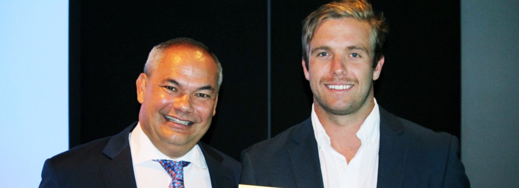 Gold Coast Mayor Tom Tate presents Kane Elgey with his award as the city's Young Citizen of the Year for 2016.