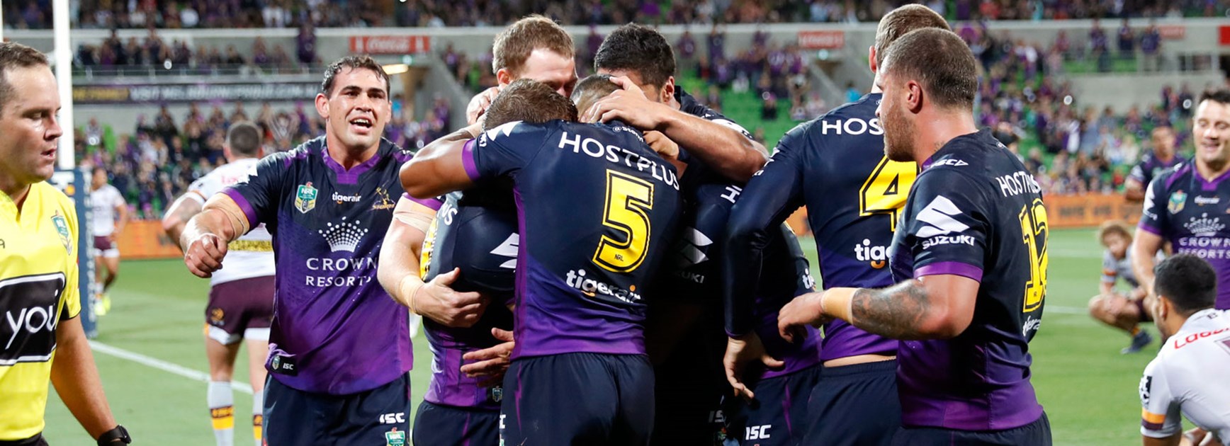 Storm players celebrate against the Broncos in Round 3.