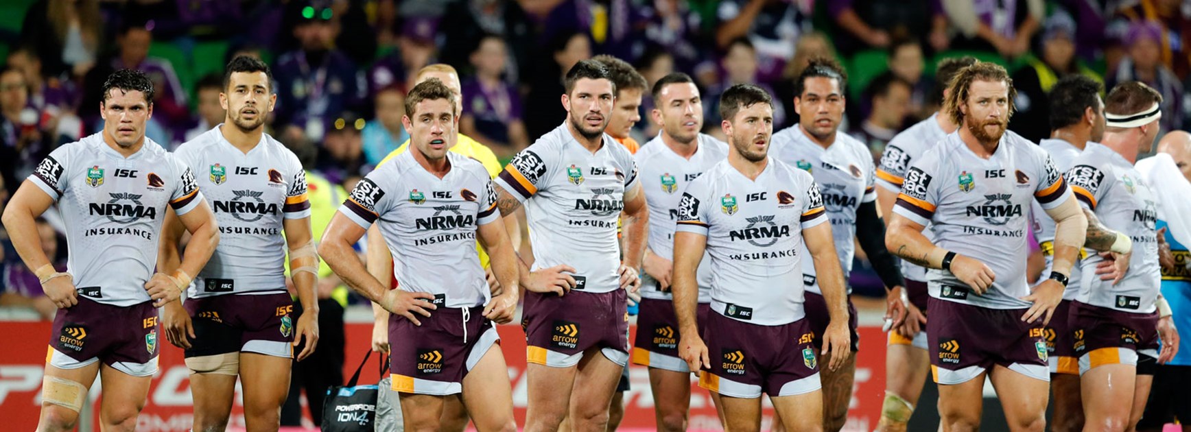 Broncos players look on dejected during their Round 3 loss to the Storm.