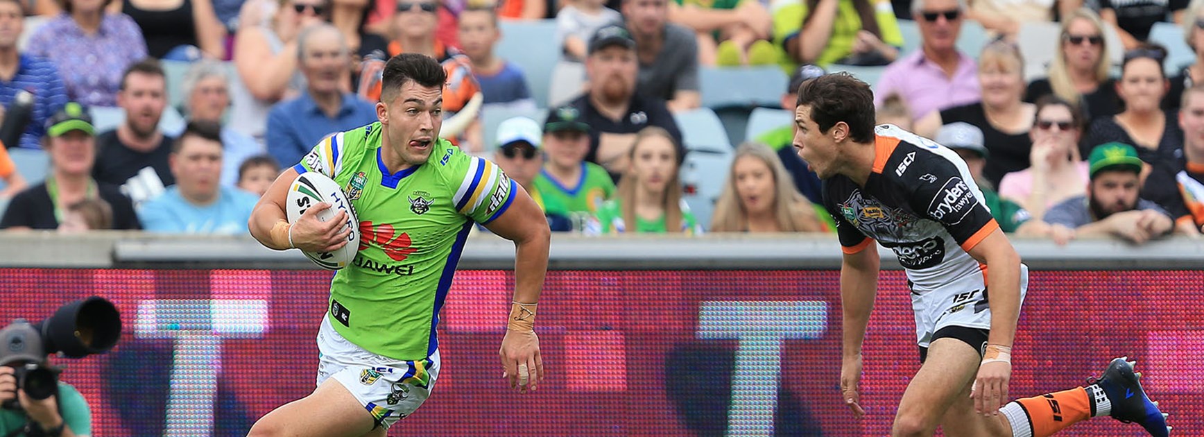 Nick Cotric tries to get away from Mitch Moses.