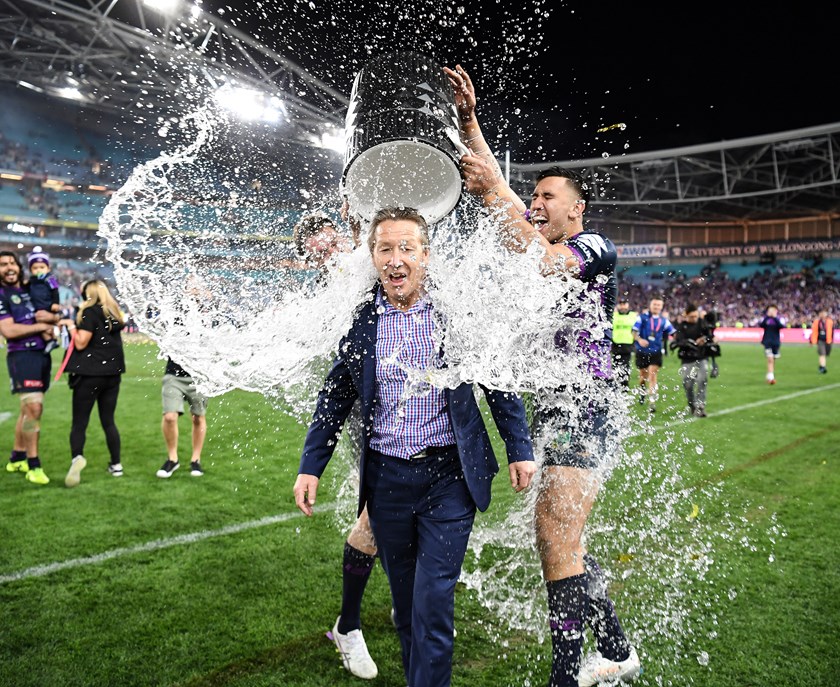 Craig Bellamy gets a shower after Melbourne's 2017 NRL Grand Final win.