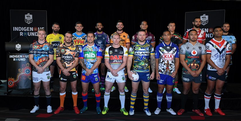 NRL players show off their clubs' Indigenous Round jerseys.