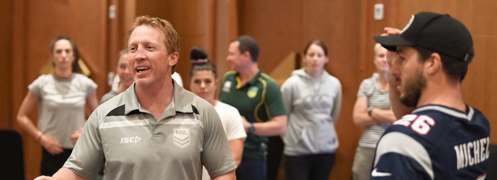 Alan Tongue leads Australian men's and women's PM's XIII players in a Voice Against Violence workshop.
