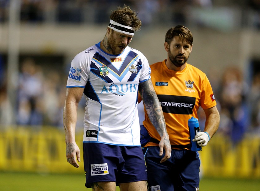 Chris McQueen is forced off due to injury while playing for the Gold Coast Titans.