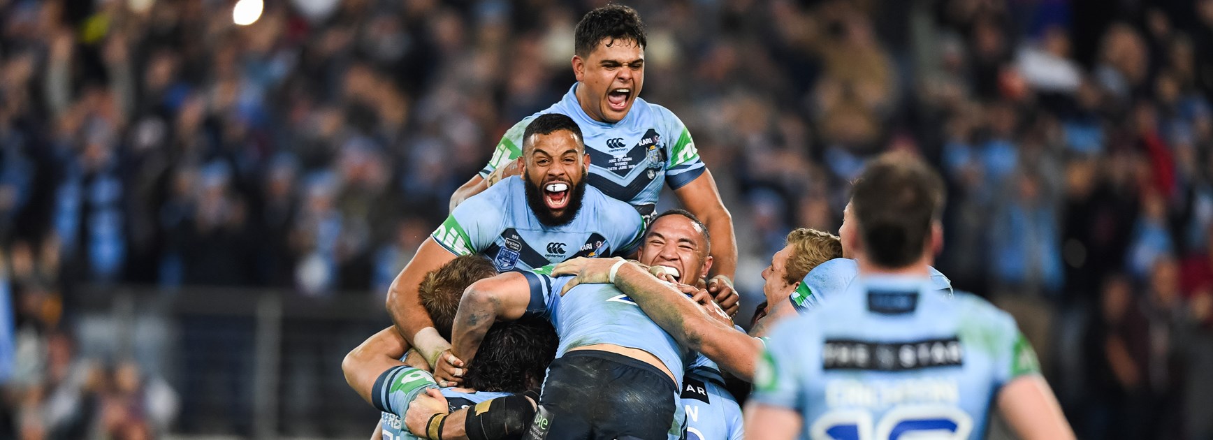The Blues celebrate victory over Queensland in game two.
