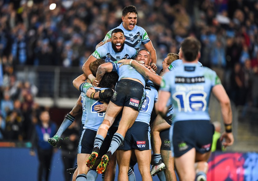 The Blues celebrate victory over Queensland in game two.