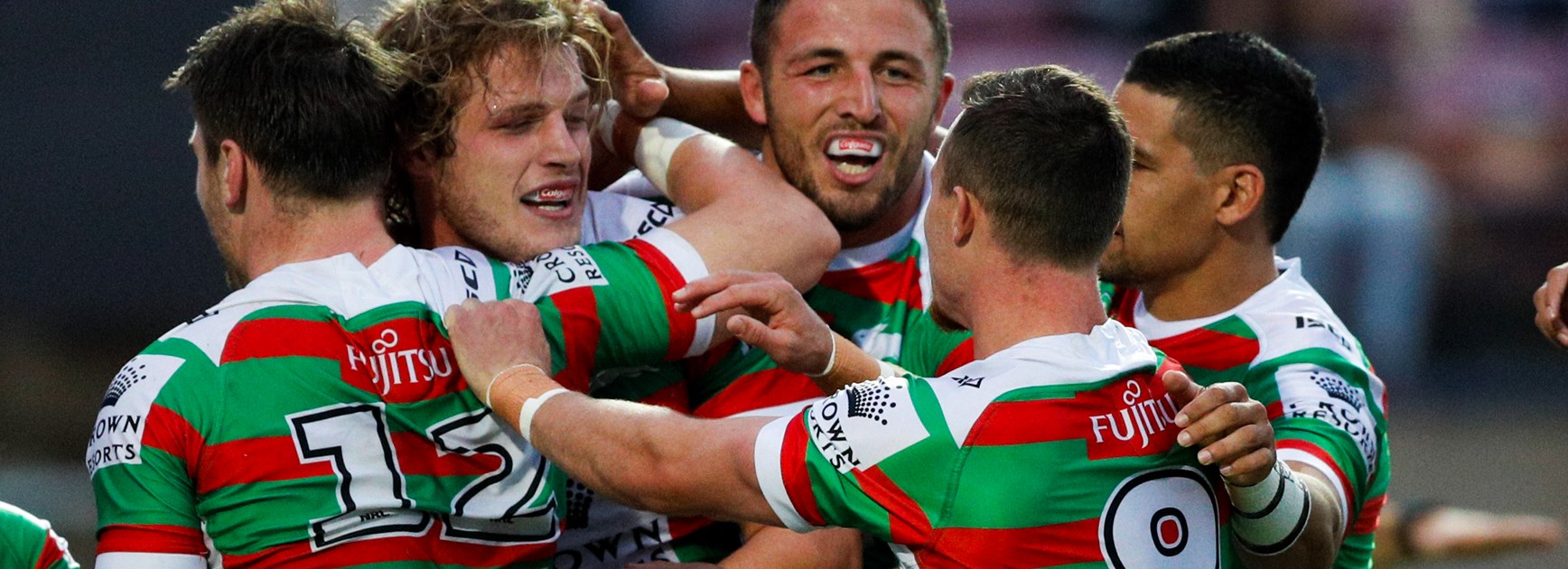 The Rabbitohs celebrate a try.