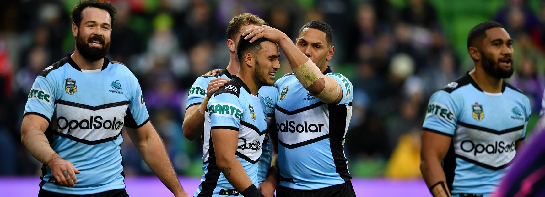 The Cronulla Sharks celebrate a try.