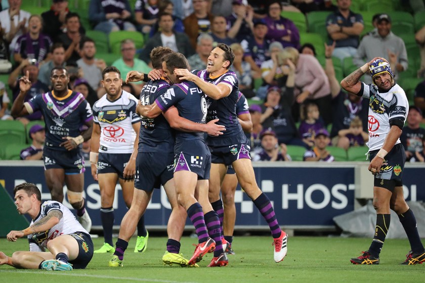 Melbourne Storm players celebrating a try. 