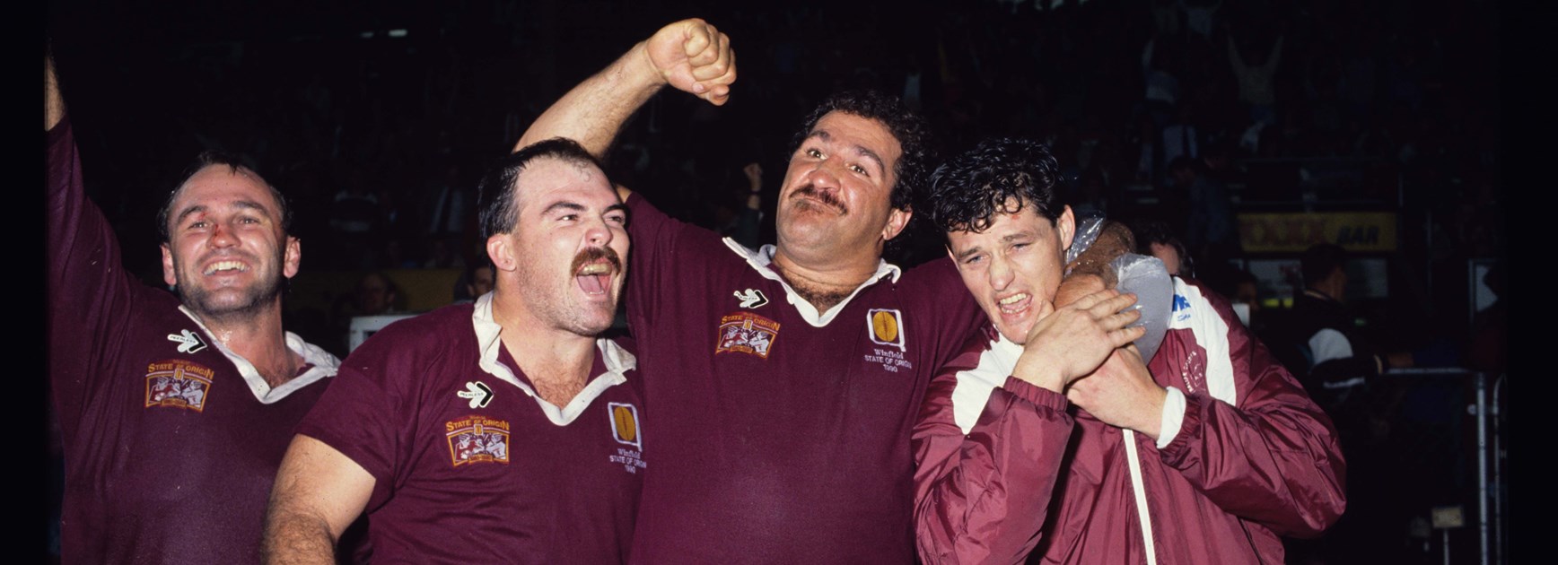 Sam Backo celebrates with Martin Bella and Peter Jackson.
