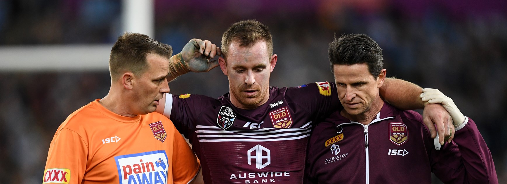 Michael Morgan leaves the field after a head knock.