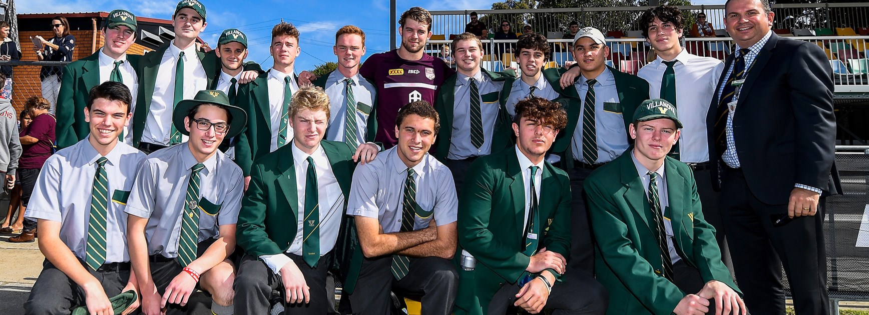 Maroons debutant Christian Welch and students from Villanova College.