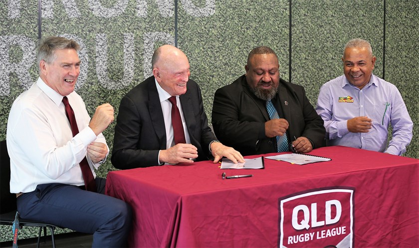 QRL managing director Rob Moore, QRL chairman Bruce Hatcher, PNG Hunters chairman Sandis Tsaka and PNG Hunters CEO Reatau Rau sign off on a new four-year participation agreement for the PNG Hunters in the Intrust Super Cup.
