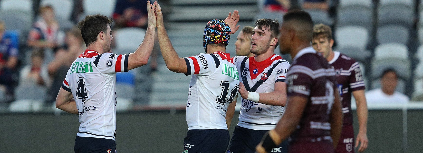The Roosters celebrate a try against Manly.