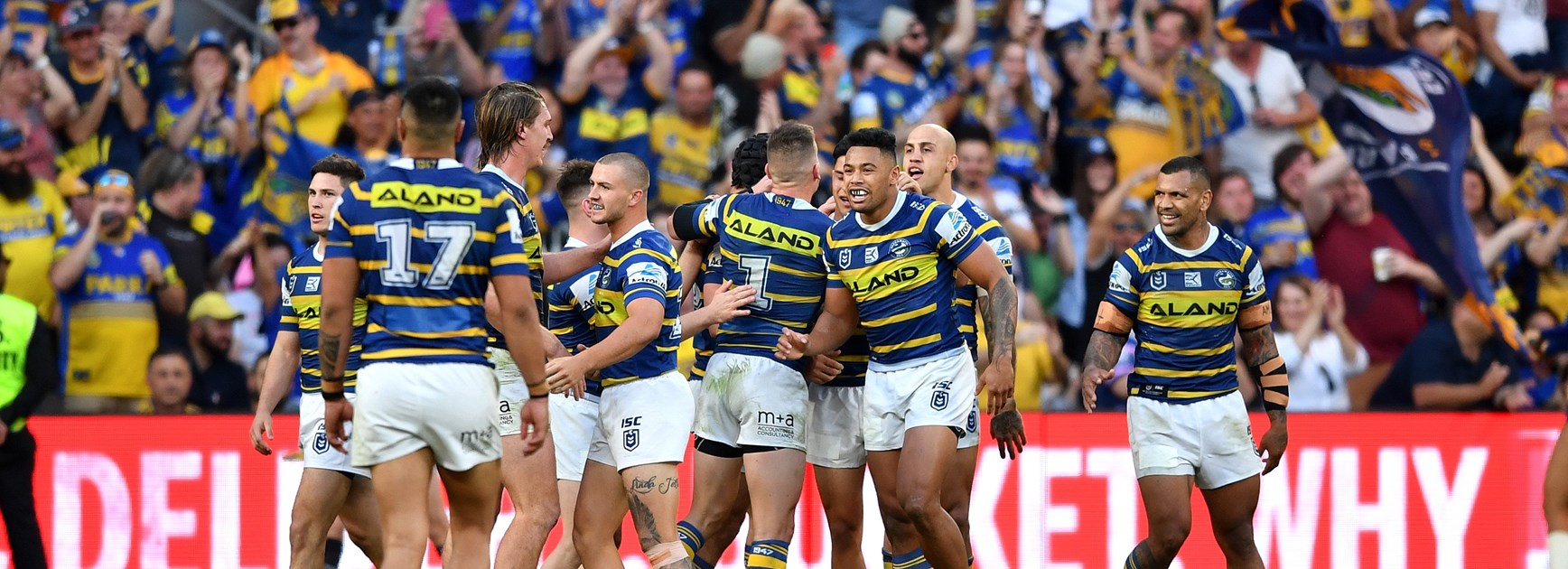 Eels players celebrate a try.