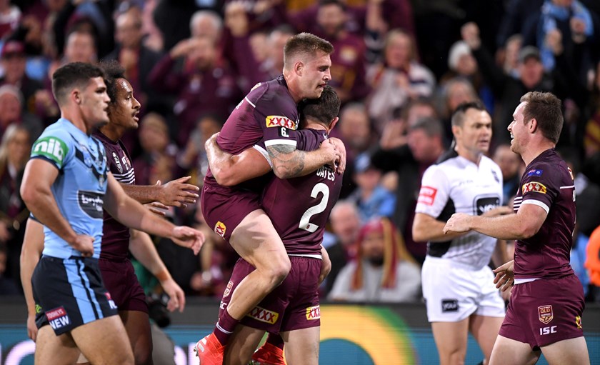 Cam Munster and Corey Oates celebrate in game one at Brisbane.