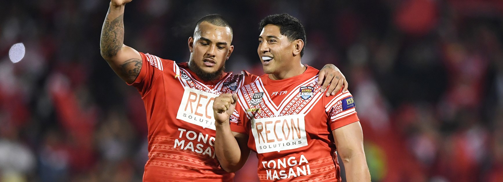 Addin Fonua-Blake (left) and Tongan teammate Jason Taumaulolo after beating Samoa in 2018.