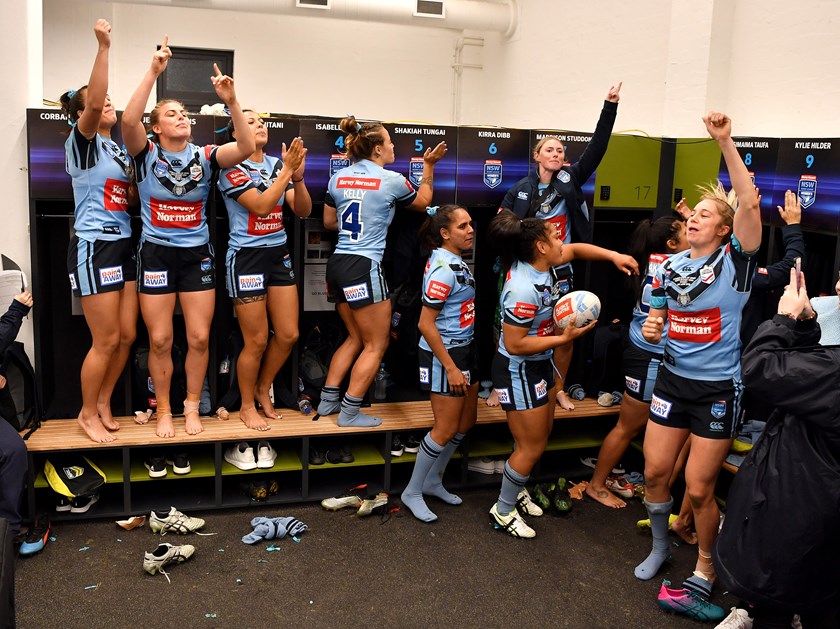 The Blues celebrate their 2019 Origin win at North Sydney Oval.