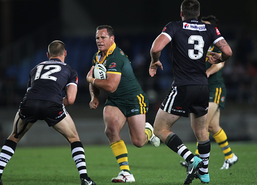 Matt Scott carts the ball up for the Kangaroos against New Zealand in 2010.