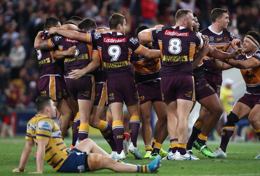 The Broncos celebrate their golden point win over the Eels.