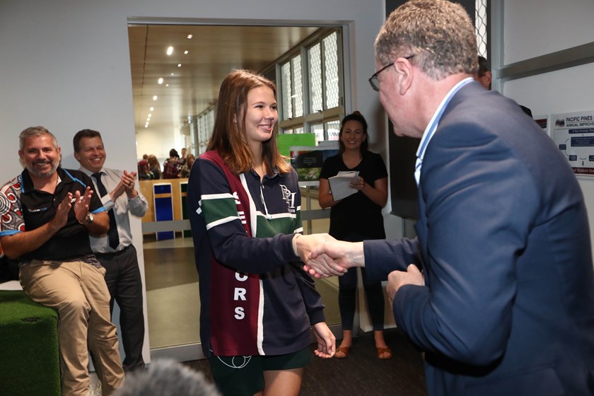 Holly Summers receives her award from NRL head of football Graham Annesley.