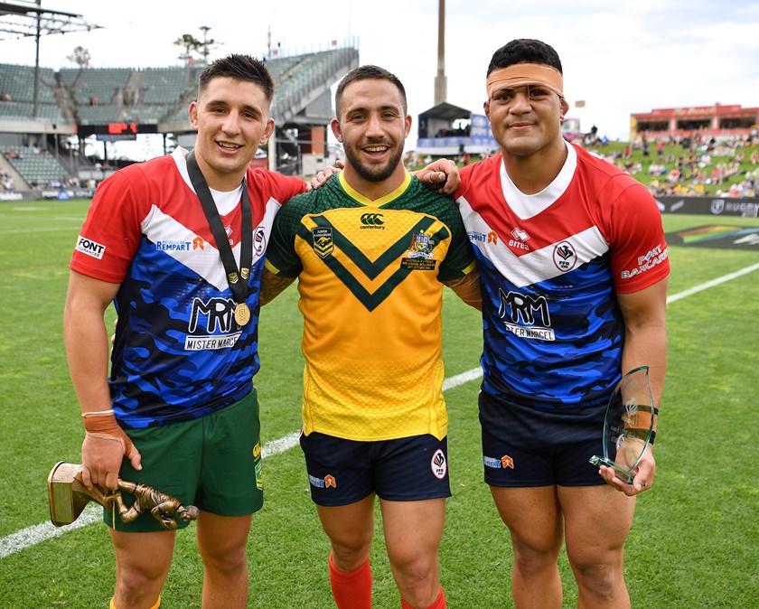 Junior Kangaroos Victor Radley and David Fifita with France's Roman Navarrete after a Test match in Wollongong in 2019.