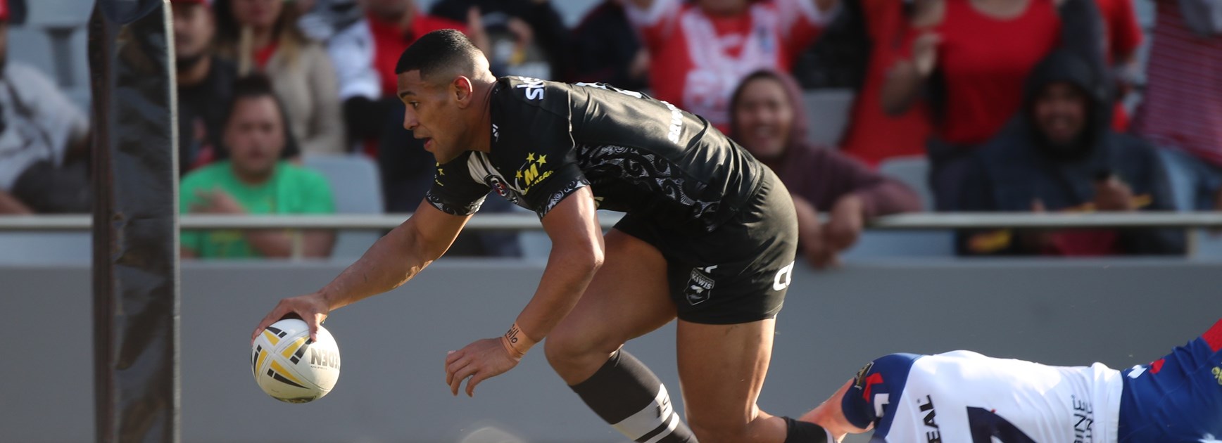 Jamayne Isaako scores a try against Great Britain.