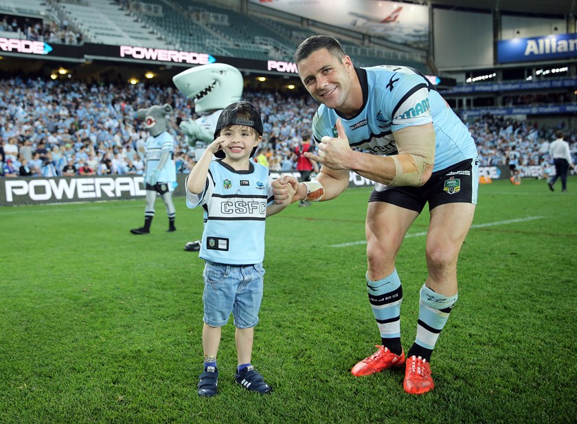 Michael Gordon with son Cruz after a Sharks win in 2015.