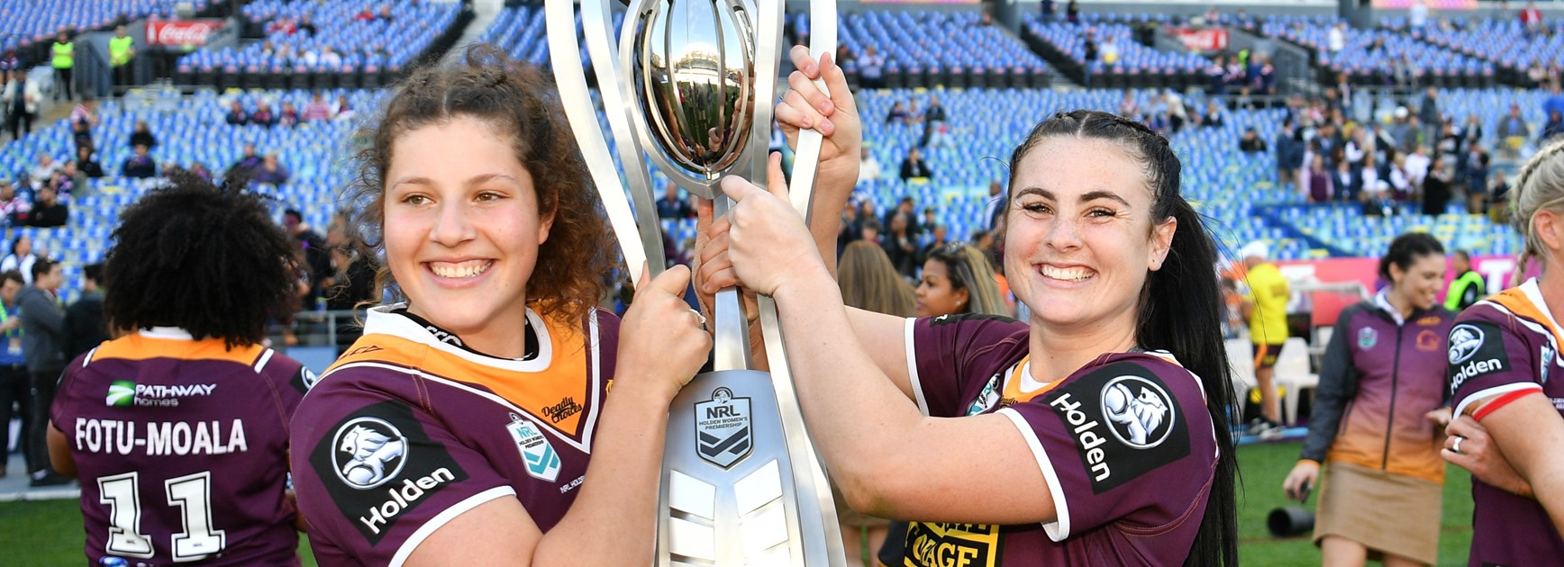 Chelsea Lenarduzzi and Amber Pilley celebrate Brisbane's 2018 grand final win.