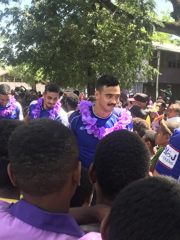 Bulldogs players make their way through the crush.