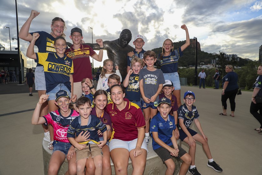 Cowboys and Broncos supporters at the Johnathan Thurston statue at the new Queensland Country Bank Stadium in round one.