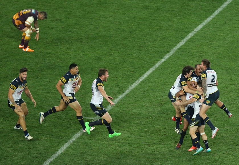 Johnathan Thurston kicks the Cowboys to victory in the 2015 grand final.