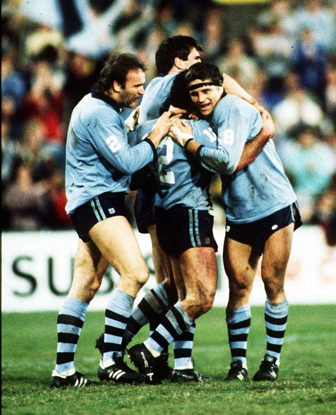 Eric Grothe, Pat Jarvis and Wayne Pearce congratulate Ben Elias after his try during Origin II at the SCG in 1985.