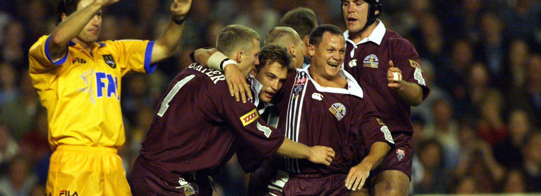 Kevin Walters is swamped during Origin I in 1998 after scoring a try in the seventh minute.
