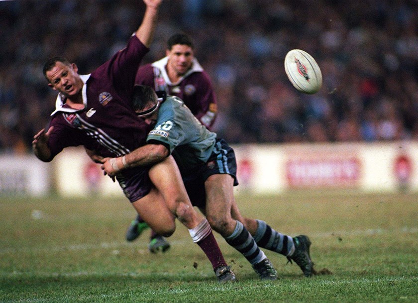 Kevin Walters gets an offload away in a tackle at the SFS.