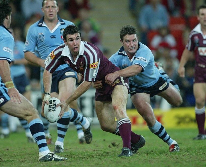 Ben Ikin tries to get Danny Buderus off his back in 2003.