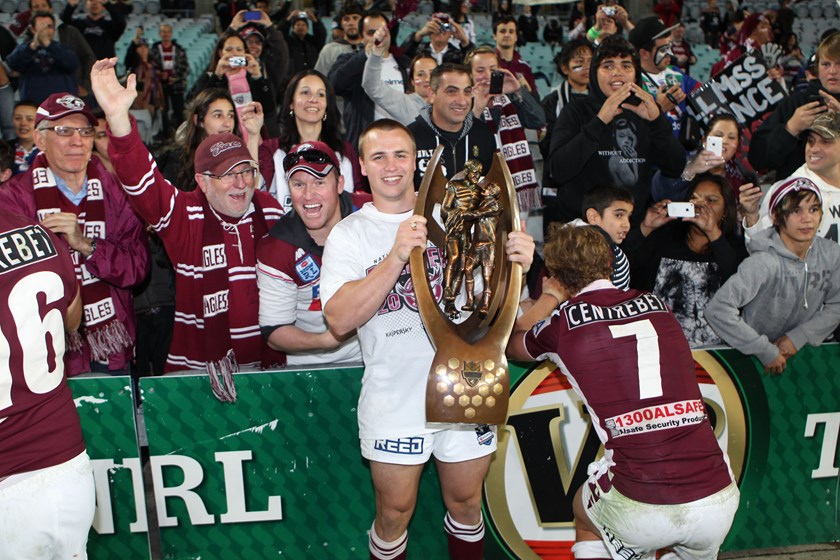 Jamie Buhrer with the premiership trophy after the 2011 grand final.