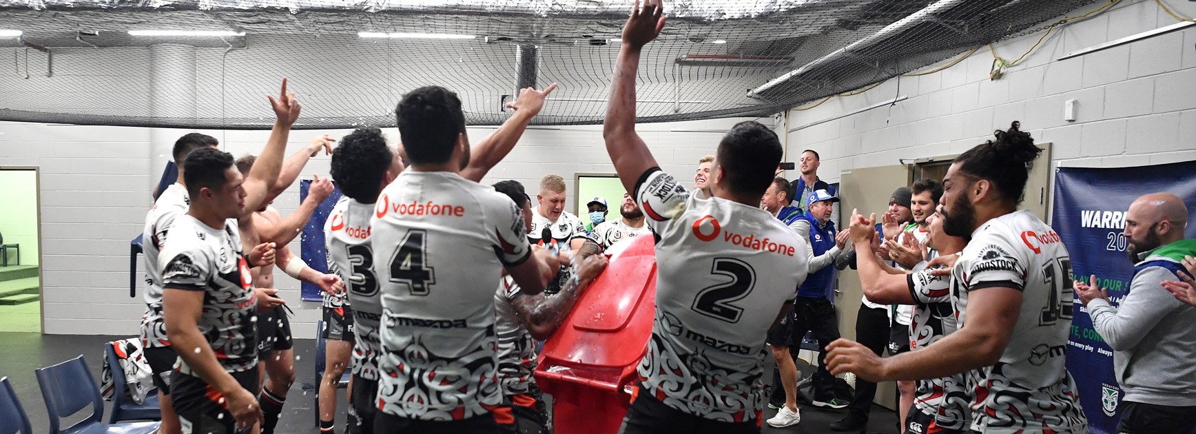 Warriors players celebrate a win.