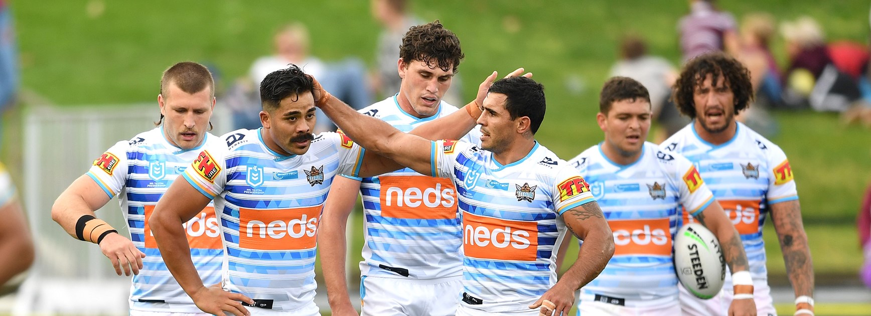 Young Tonumaipea and teammates celebrate a try.