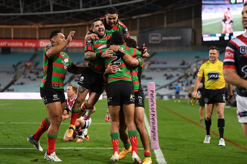 Alex Johnston is mobbed after his fifth try against the Roosters in round 20, 2020.