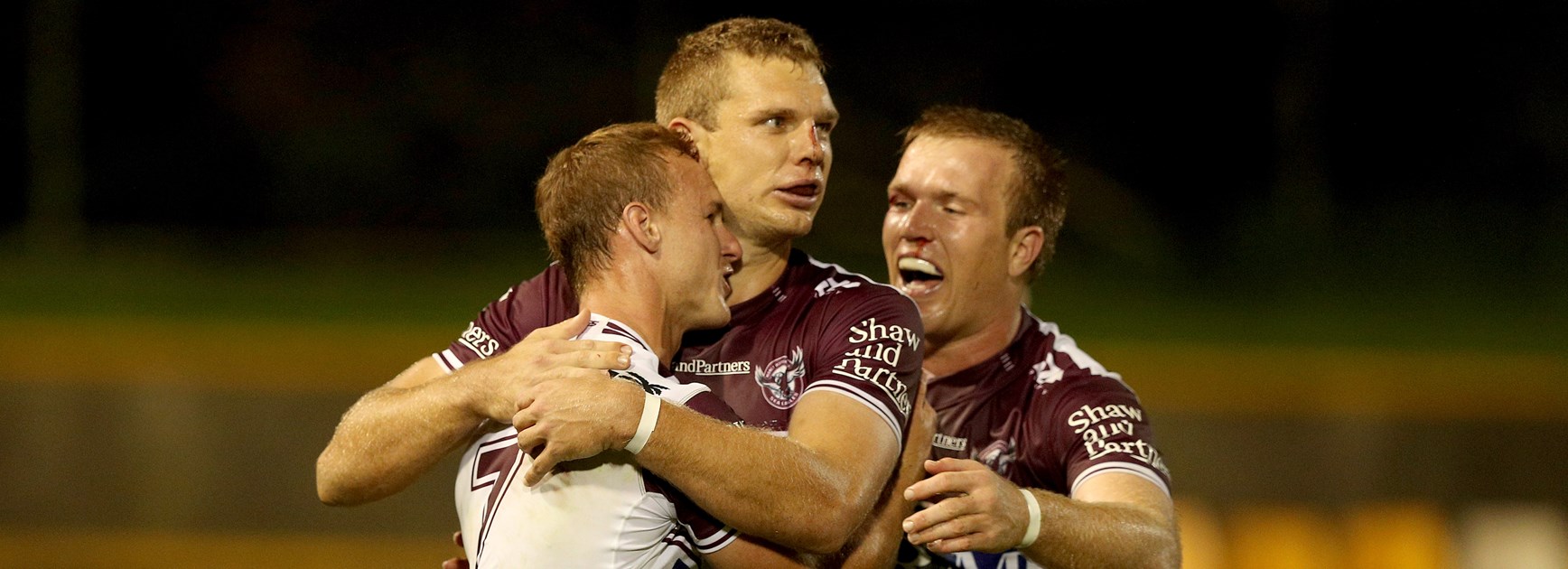 Tom Trbojevic, Daly Cherry-Evans and Jake Trbojevic celebrate a win.