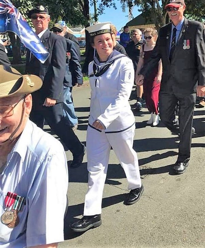 Michaela Peck marching on Anzac Day, 2018.